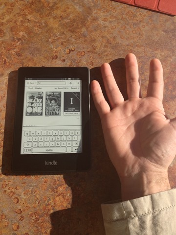My hand compared to the Kindle Paperwhite