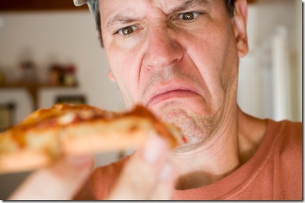 Man Eating Pepperoni Pizza